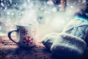 Warm coffee and winter gloves